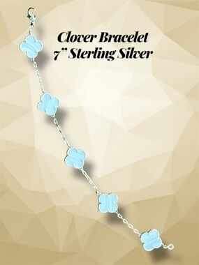 7 in. Sterling Silver Clover Bracelet with Light Blue Accents. New